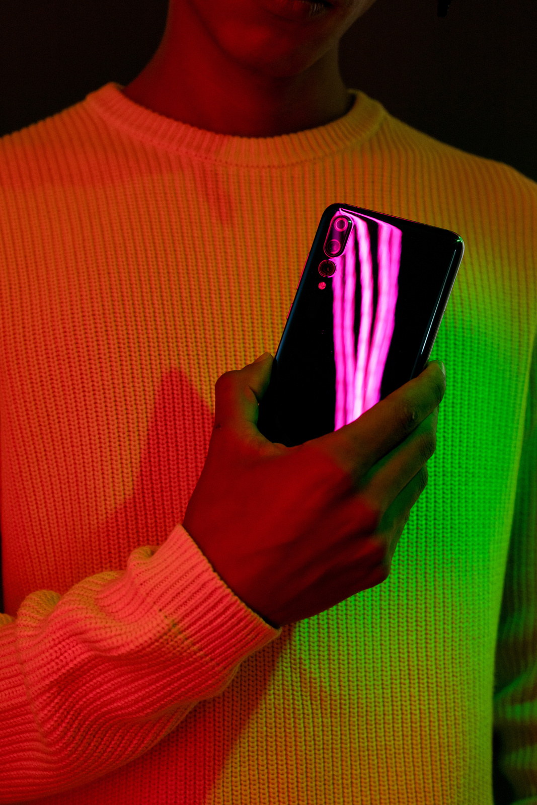 Tech Glow Person Holding a Smartphone